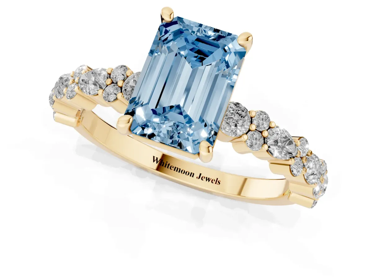 Fancy Blue Emerald Cut Diamond Side Stone Solitaire Ring with Round and Four-Prong Setting Yellow gold