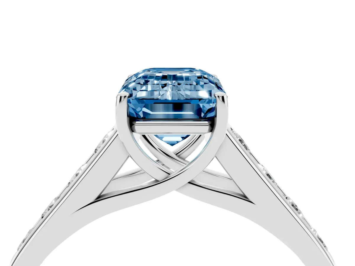Fancy Blue Emerald Cut Solitaire Channel-Set Diamond Engagement Ring with Four-Prong Setting Silver