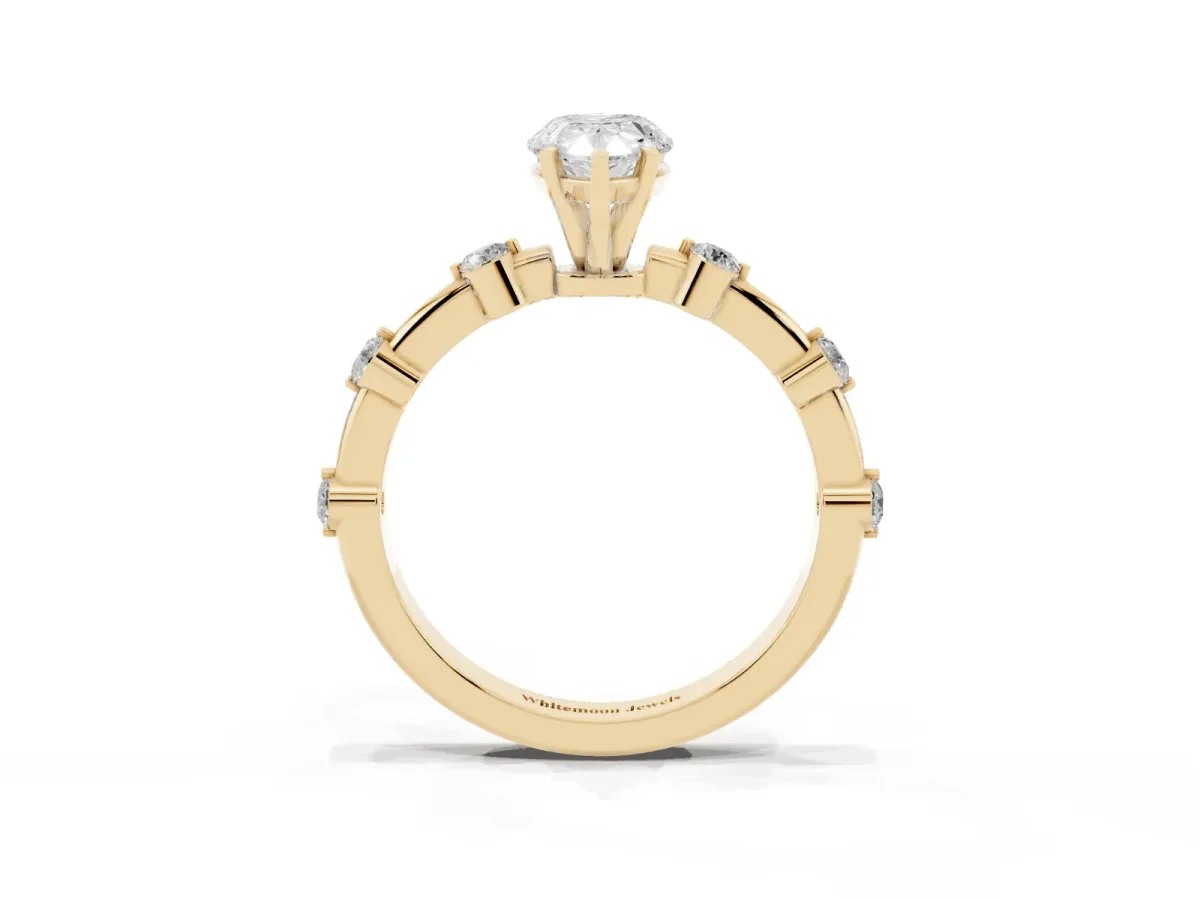 Pear Cut Solitaire Diamond Ring with Bezel Set Side Stones and Prong Setting Yellow gold