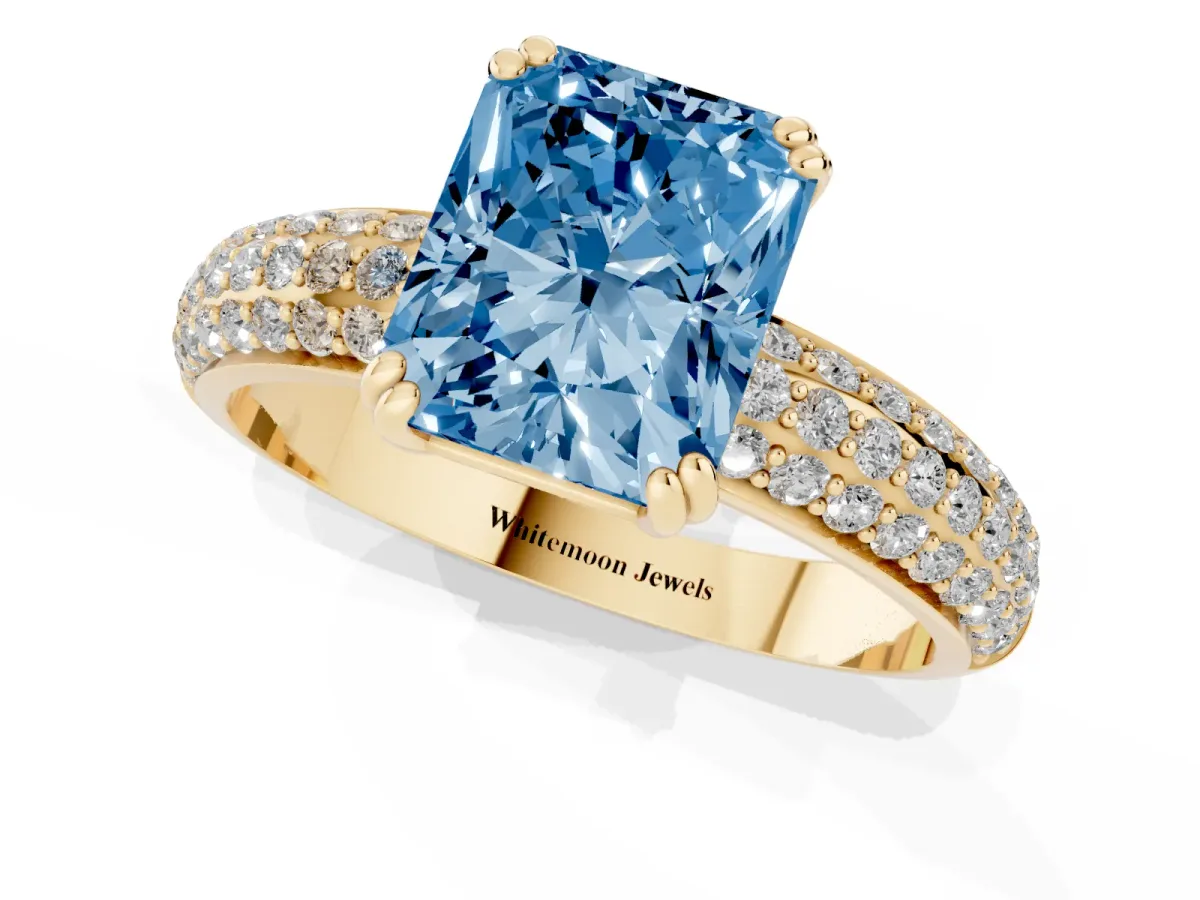 Fancy Blue Radiant Cut Diamond Solitaire Ring with Multi-Row Round Pavé Band and Prong Setting Yellow gold