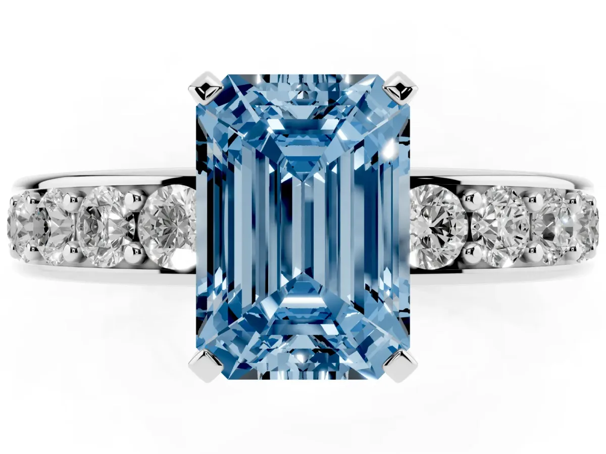 Fancy Blue Emerald Cut Diamond Engagement Ring with Channel Set Round Band and Prong Setting Silver