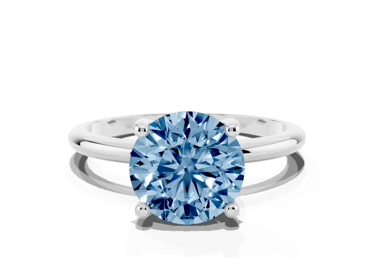 Fancy Blue Round Cut Solitaire Diamond Ring with 4-Prong Setting on a Classic Band Silver