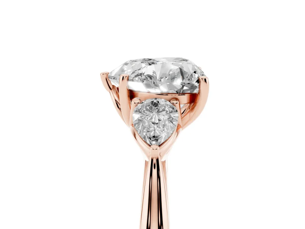Three-Stone Heart Cut Diamond Ring with Pear Side Stones in Four-Prong Setting Rose gold