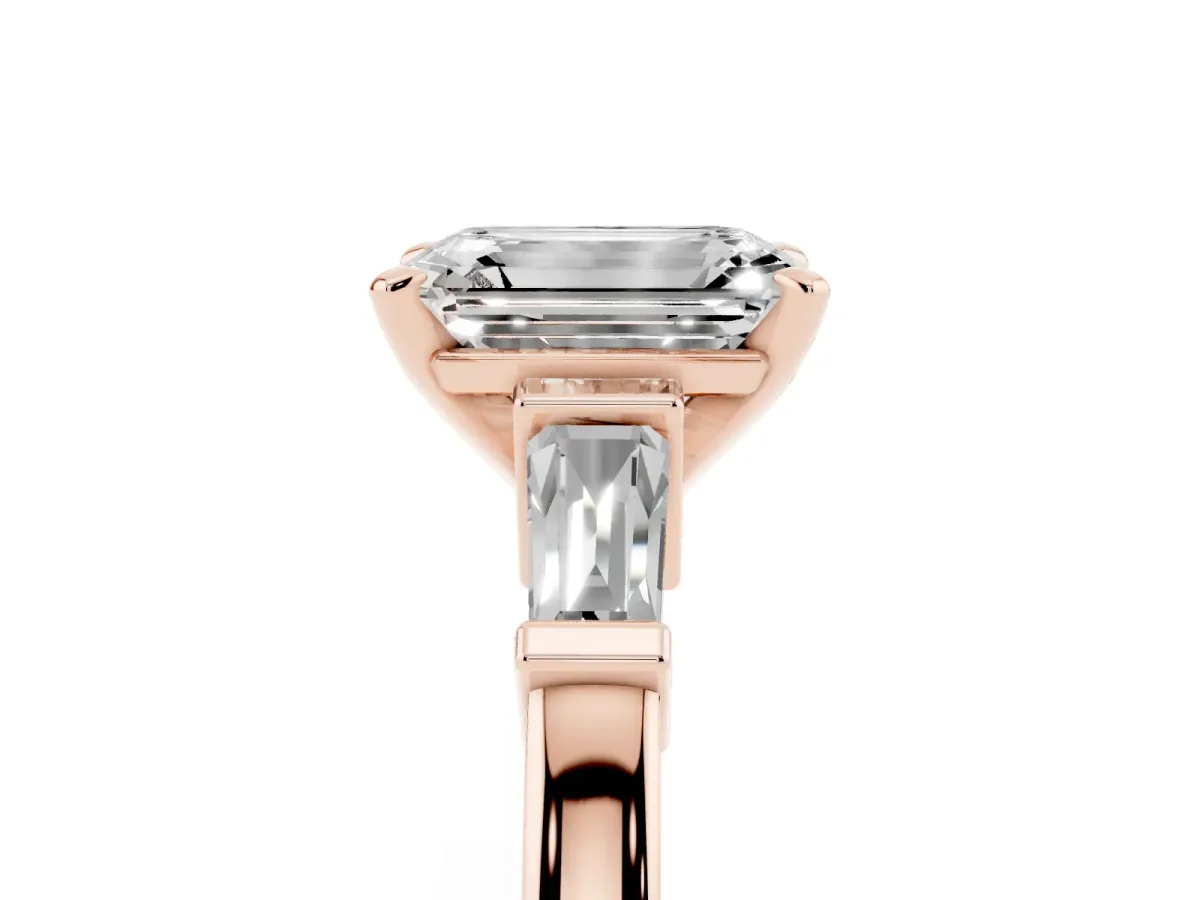 Emerald Cut Cut Diamond Solitaire Ring with Tapered Baguette Accents and Four-Prong Setting Rose gold