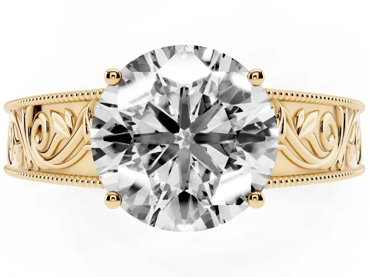 Round Cut Diamond Solitaire Ring with Engraved Band and Four-Prong Setting Yellow gold