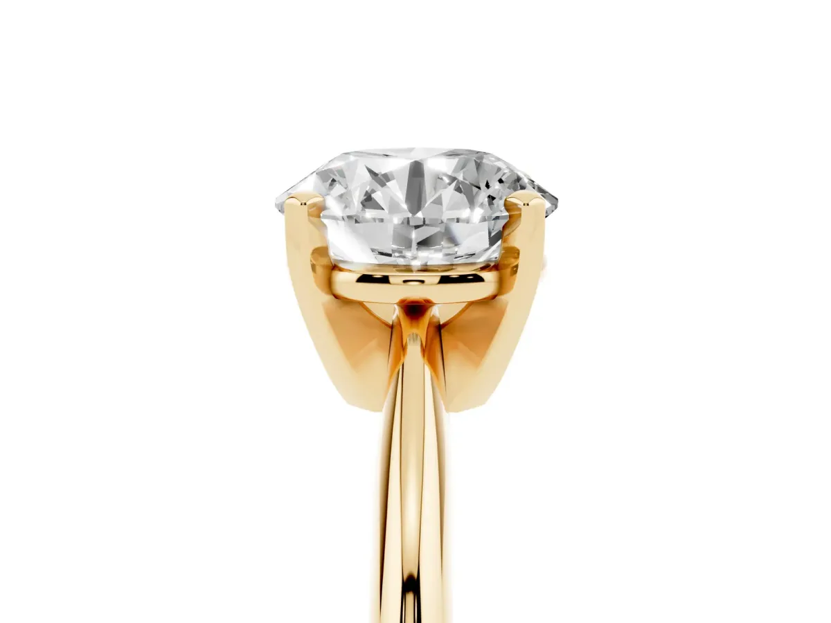 Round Cut Cut Solitaire Ring with Four-Prong Setting on a Classic Band Yellow gold