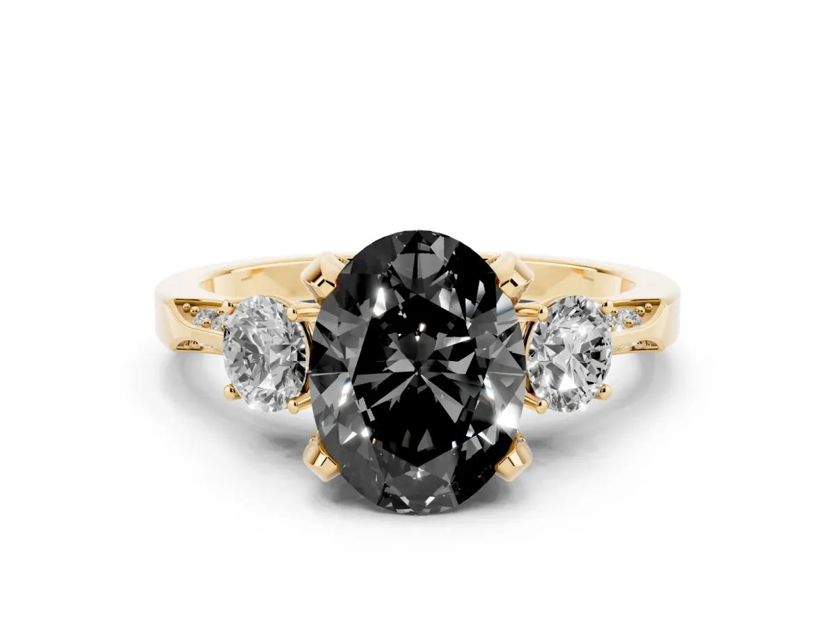 Fancy Black Oval Cut Brilliant Three-Stone Diamond Ring with Pavé Band and Four-Prong Setting Yellow gold
