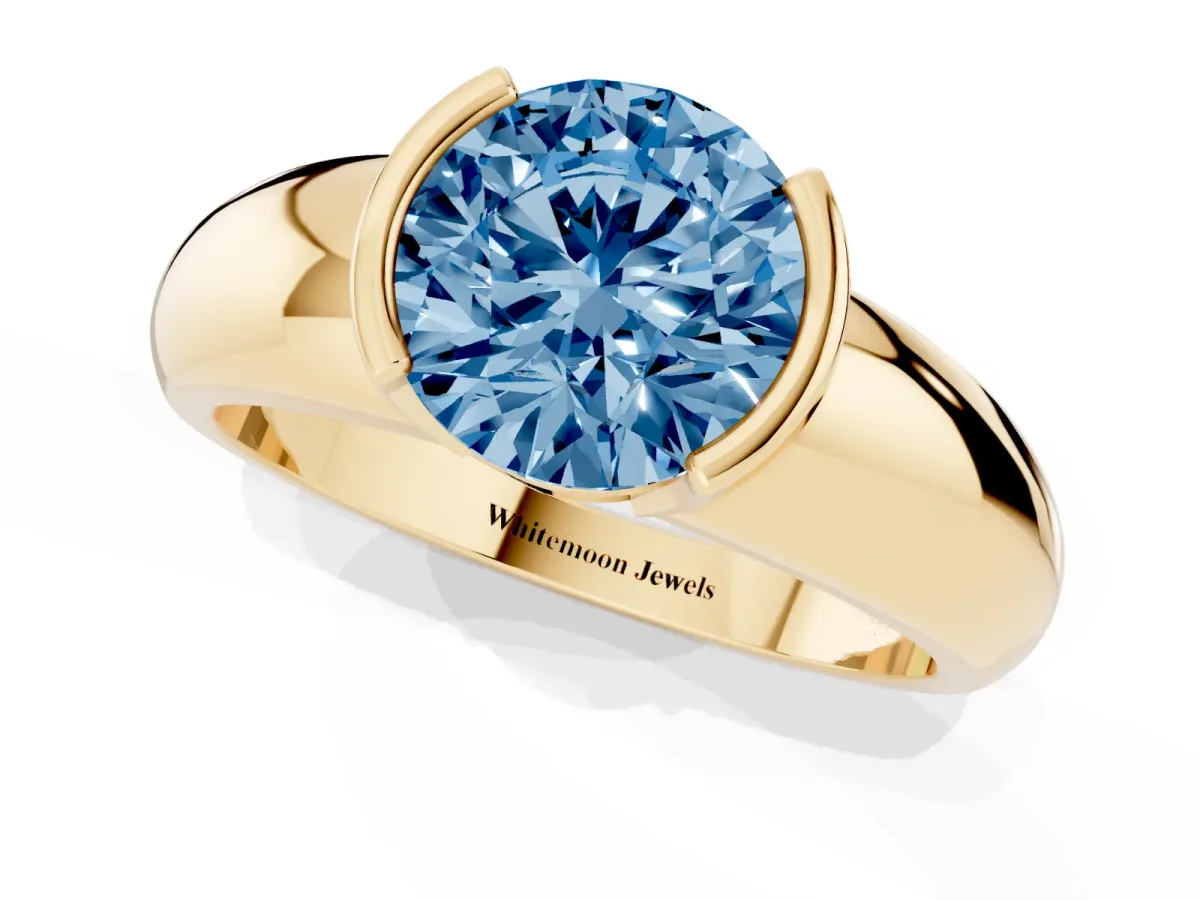 Fancy Blue Round Cut Solitaire Tension Set Diamond Ring with Wide Band Yellow gold