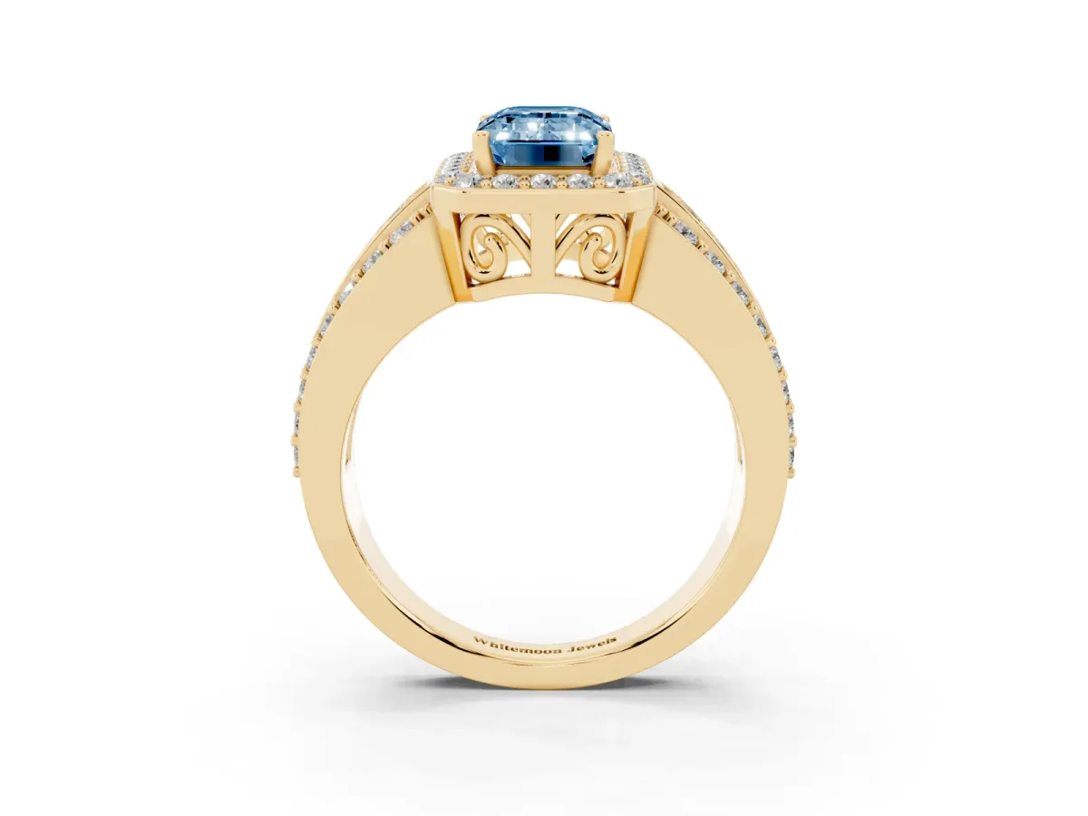 Fancy Blue Emerald Cut Halo Diamond Ring with Round Split Shank and Prong Setting Yellow gold
