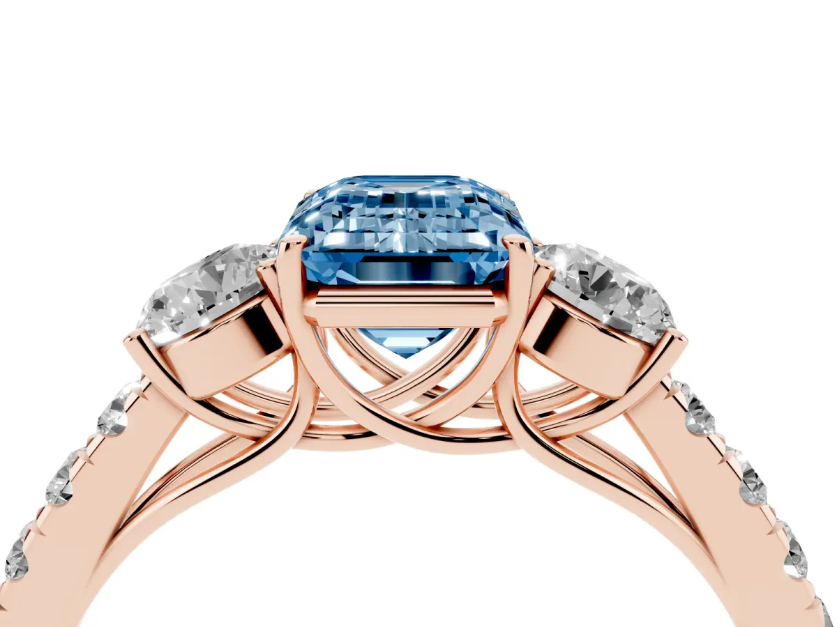 Fancy Blue Emerald Cut Cut Diamond Three-Stone Ring with Round Side Stones and Pavé Band Rose gold