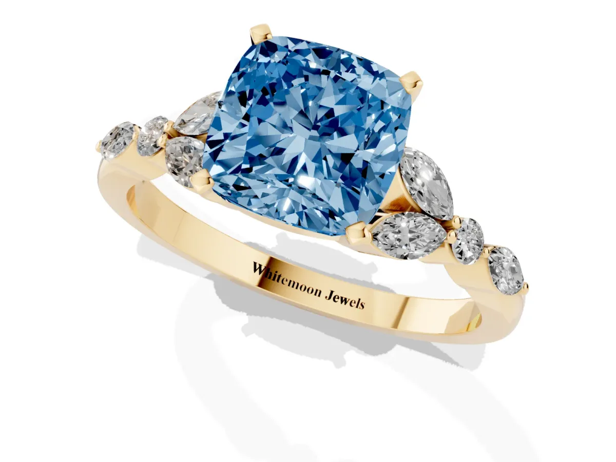 Fancy Blue Cushion Cut Diamond Solitaire Ring with Side Stones and Four-Prong Setting Yellow gold