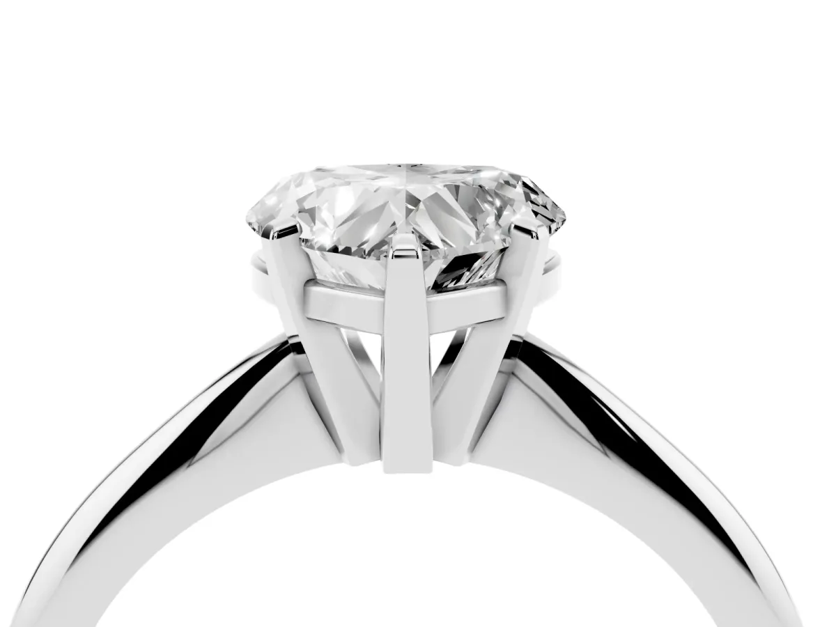 Heart Cut Cut Solitaire Ring with Four-Prong Setting on a Classic Band Silver