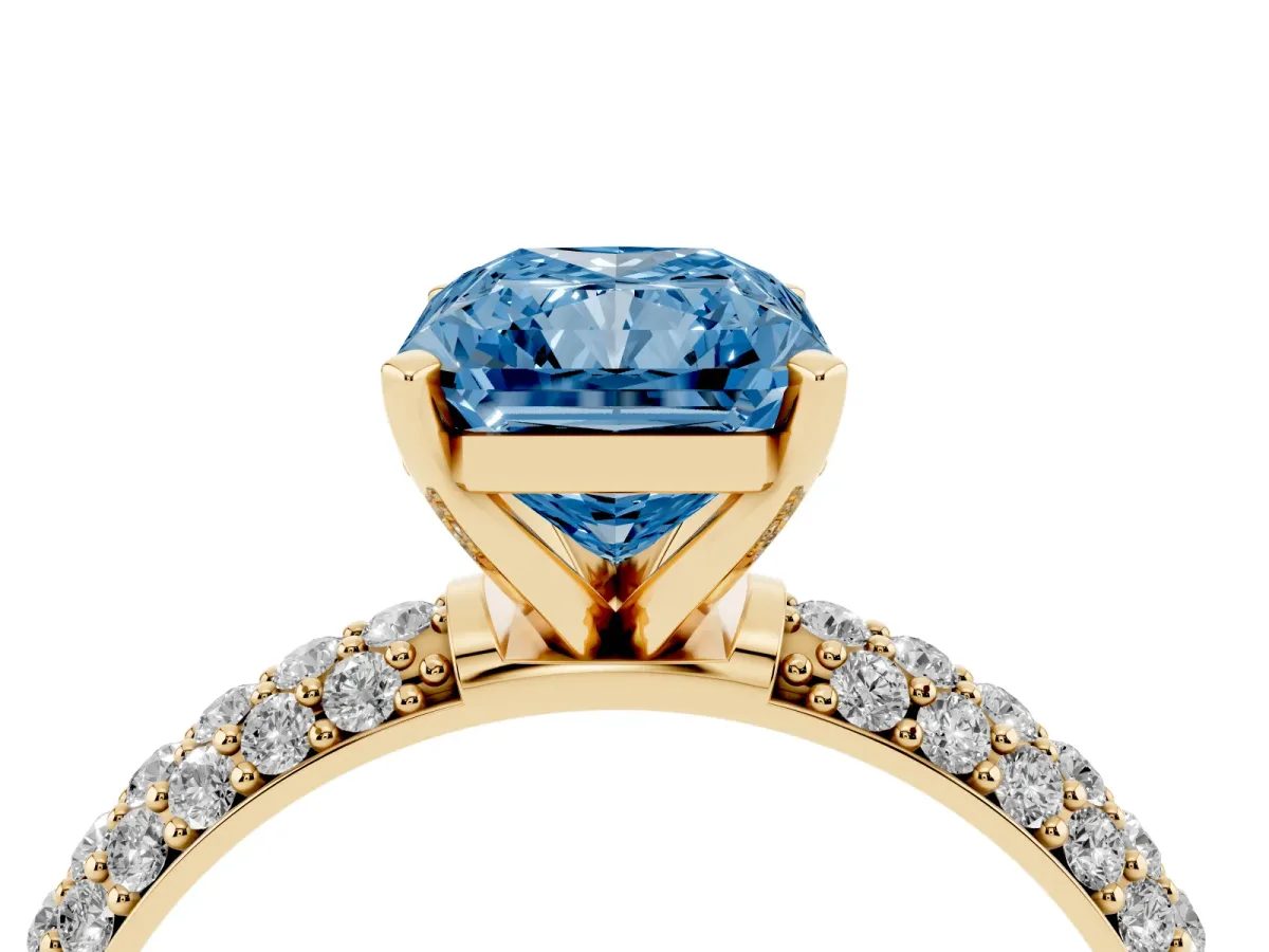 Fancy Blue Radiant Cut Diamond Solitaire Ring with Prong Setting and Pavé Band Yellow gold