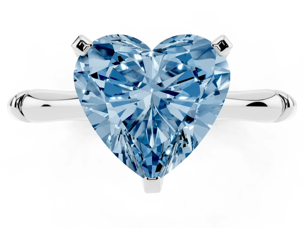 Fancy Blue Heart Cut Solitaire Diamond Ring with Bamboo Band and Four-Prong Setting Silver
