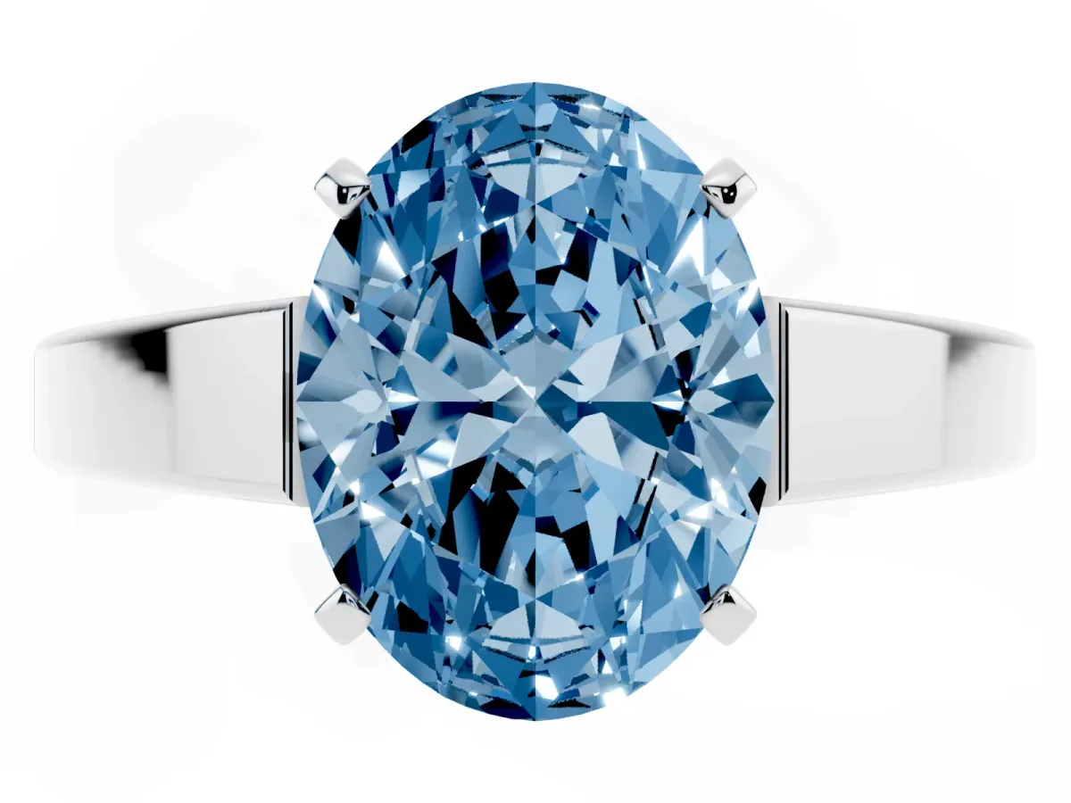 Fancy Blue Oval Cut Solitaire Engagement Ring with Four-Prong Setting and Tapered Band Silver