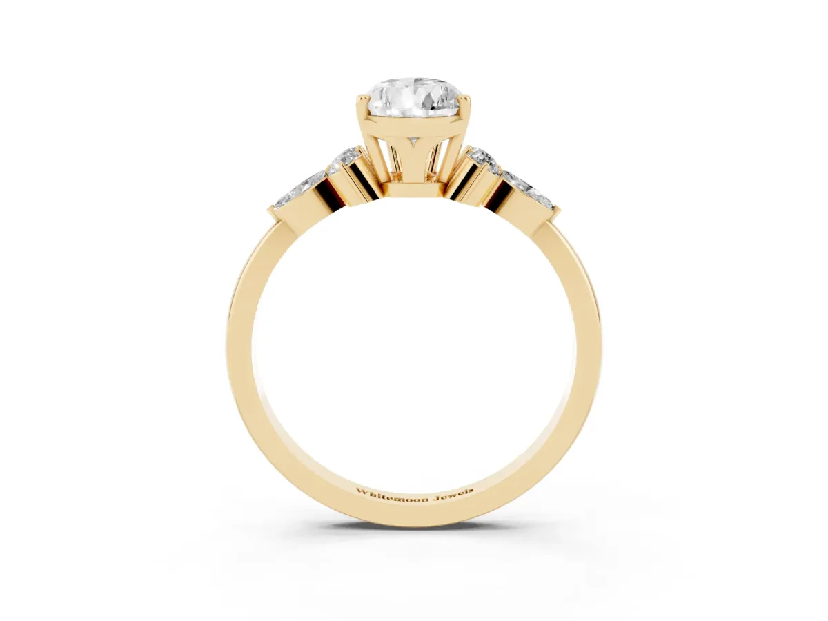 Pear Cut Brilliant Diamond Solitaire Ring with Pear Side Stones and Four-Prong Setting Yellow gold