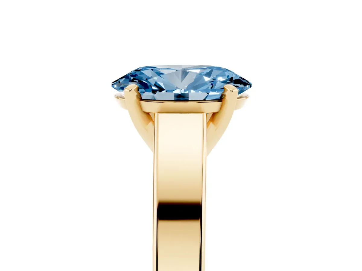 Fancy Blue Oval Cut Solitaire Engagement Ring with Four-Prong Setting and Tapered Band Yellow gold