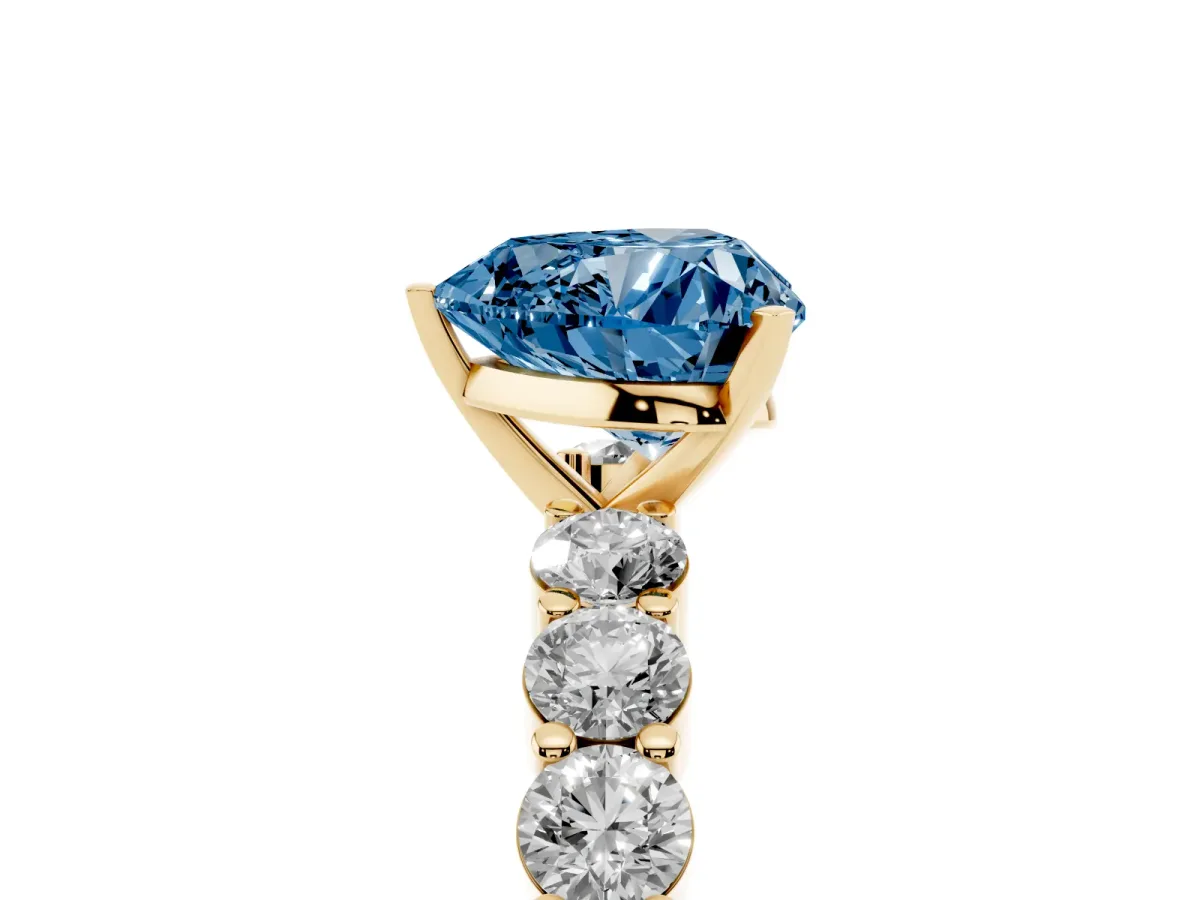Fancy Blue Heart Cut Diamond Solitaire Ring with Shared Prong Round Side Stones Yellow gold