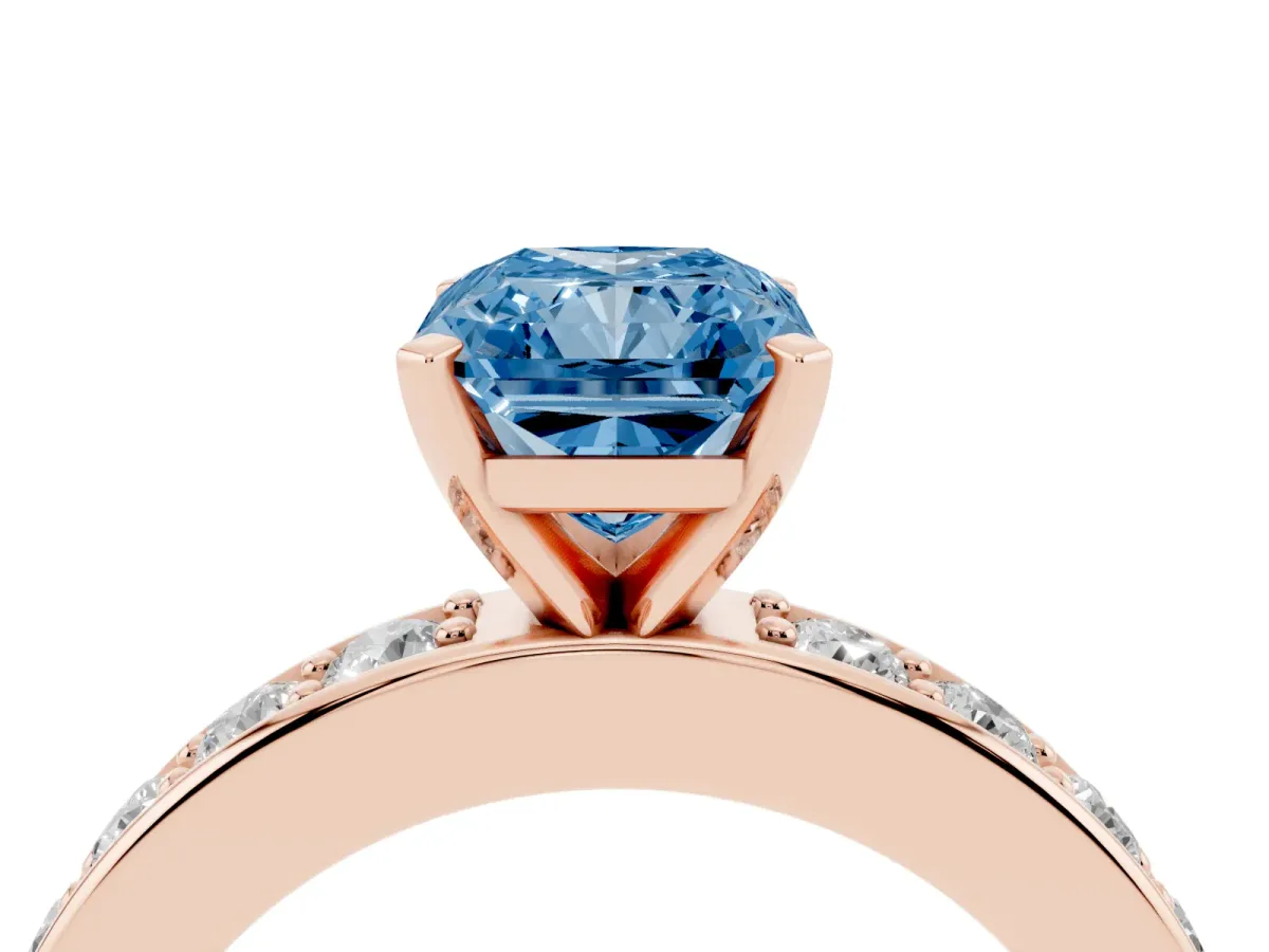 Fancy Blue Radiant Cut Diamond Engagement Ring with Channel Set Round Band and Prong Setting Rose gold