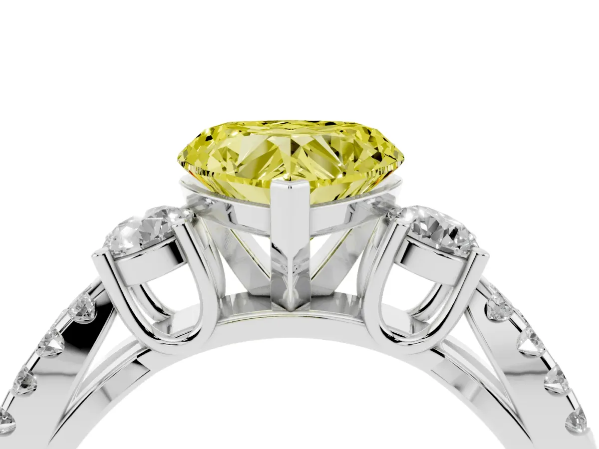 Fancy Yellow Heart Cut Diamond Three-Stone Ring with Pavé Split Shank and Four-Prong Setting Platinum