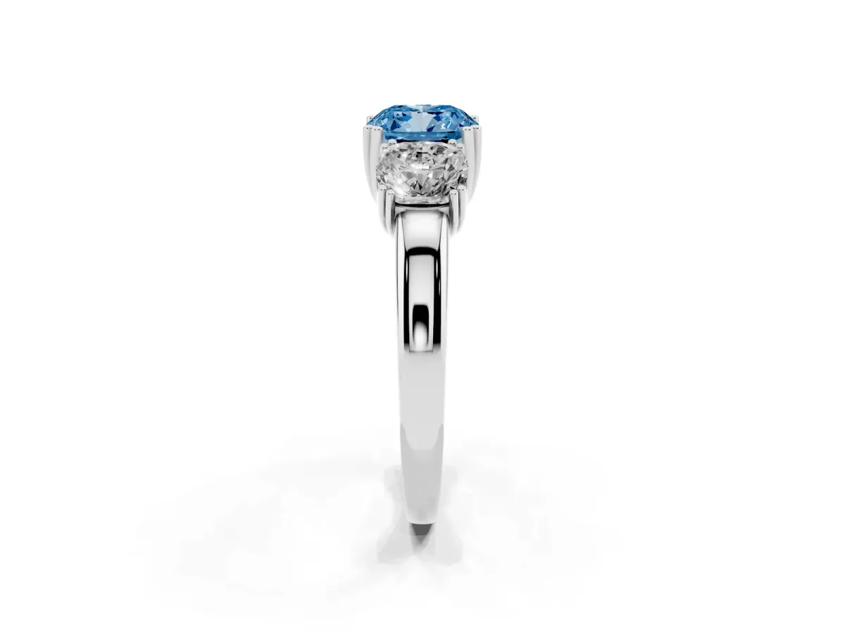Fancy Blue Three-Stone Cushion Cut Cut Diamond Ring with Channel Set Band and Four-Prong Setting Platinum