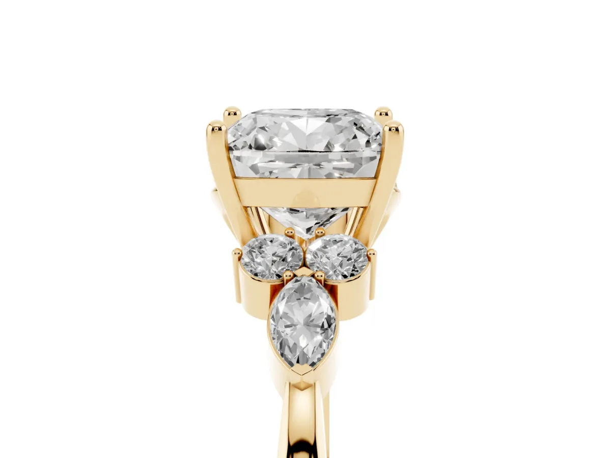 Cushion Cut Brilliant Diamond Solitaire Ring with Pear Side Stones and Four-Prong Setting Yellow gold