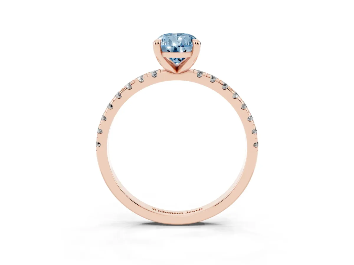 Fancy Blue Pear Cut Diamond Brilliant Solitaire Ring with Pavé Band and Four-Prong Setting Rose gold