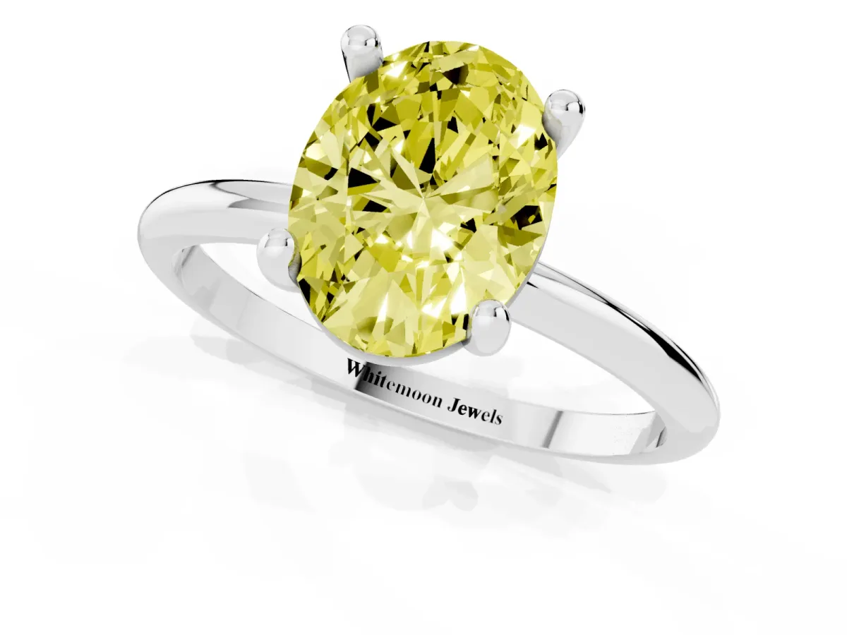 Fancy Yellow Oval Cut Solitaire Diamond Ring with 4-Prong Setting on a Classic Band Platinum