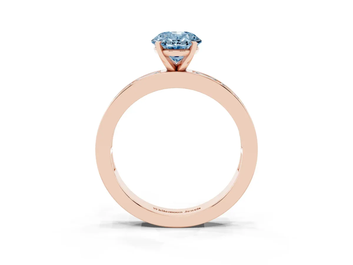 Fancy Blue Oval Cut Solitaire Diamond Ring with Channel-Set Baguette Band and Four-Prong Setting Rose gold