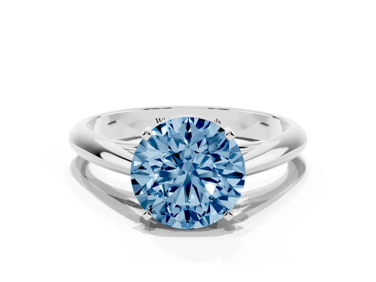 Fancy Blue Round Cut Diamond Solitaire Engagement Ring with Cathedral Setting and Four-Prong Mount Silver
