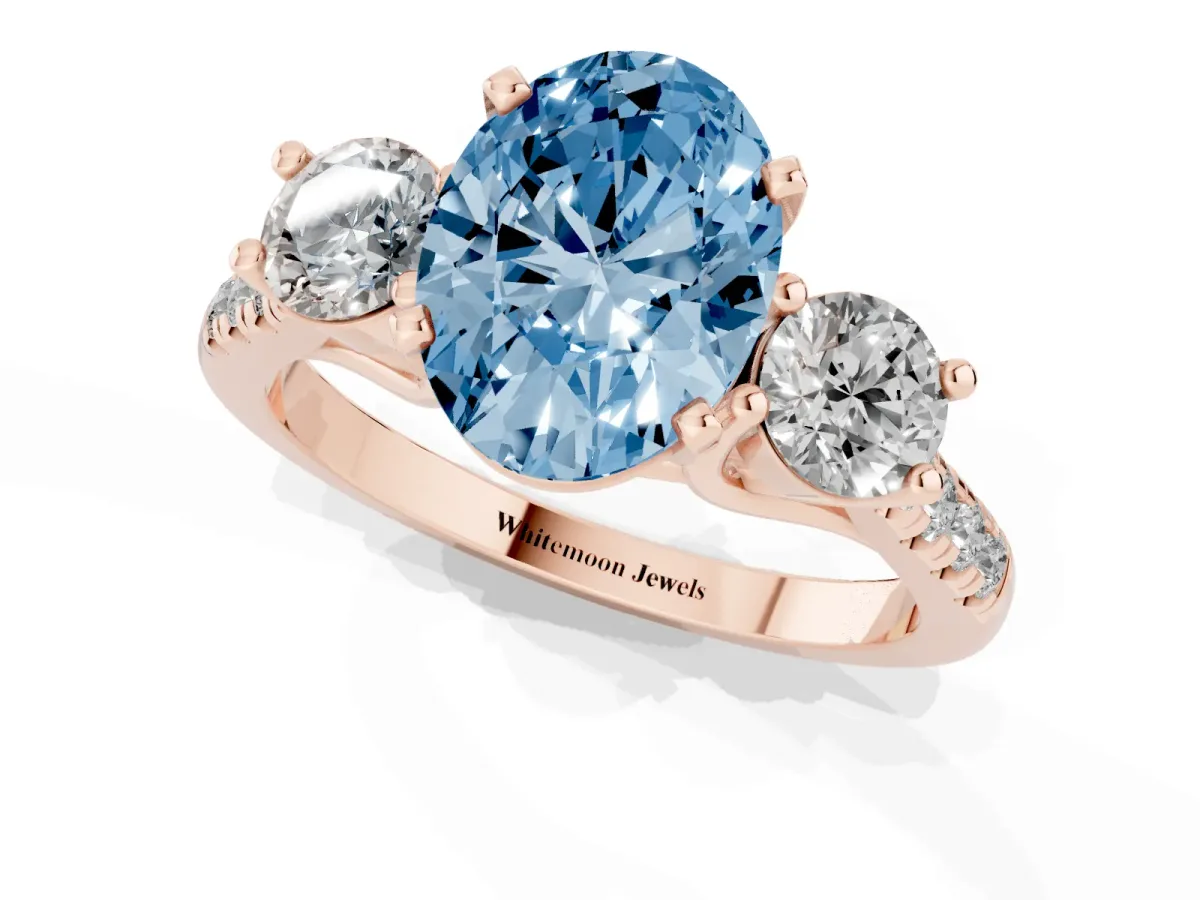 Fancy Blue Three-Stone Oval Cut Diamond Pavé Band with Four-Prong Setting Rose gold
