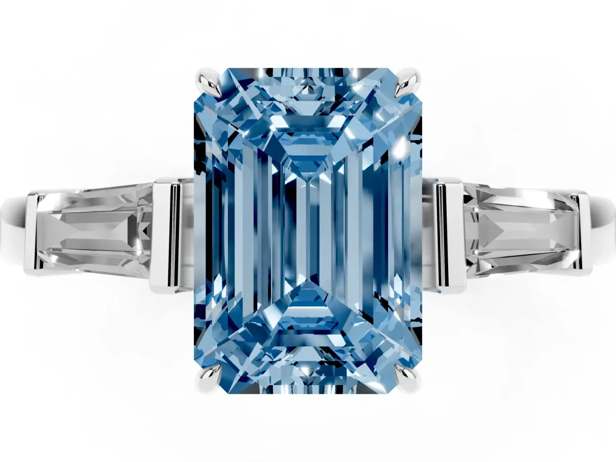 Fancy Blue Emerald Cut Diamond Three-Stone Ring with Tapered Baguette Side Stones and Prong Setting Platinum