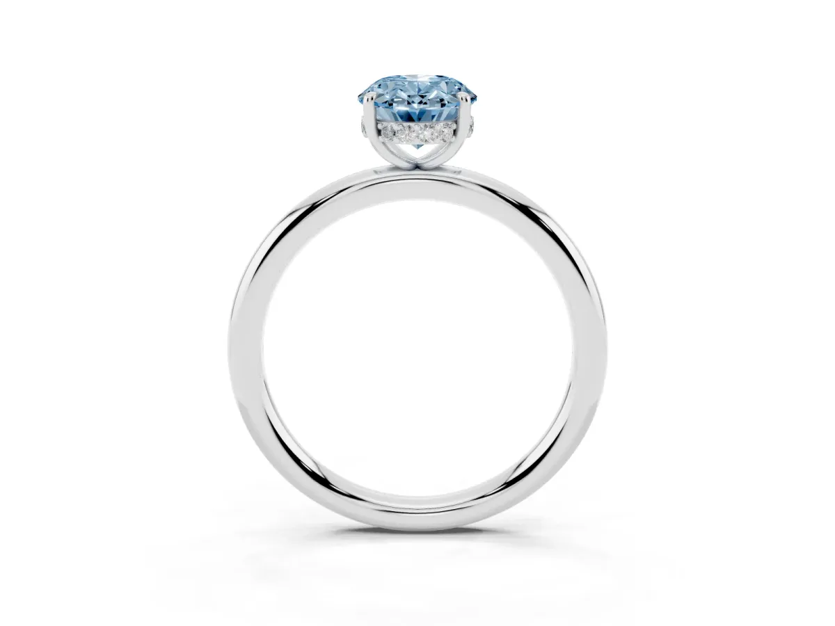 Fancy Blue Oval Cut Diamond Solitaire Ring with Thin Band and Four-Prong Setting Silver