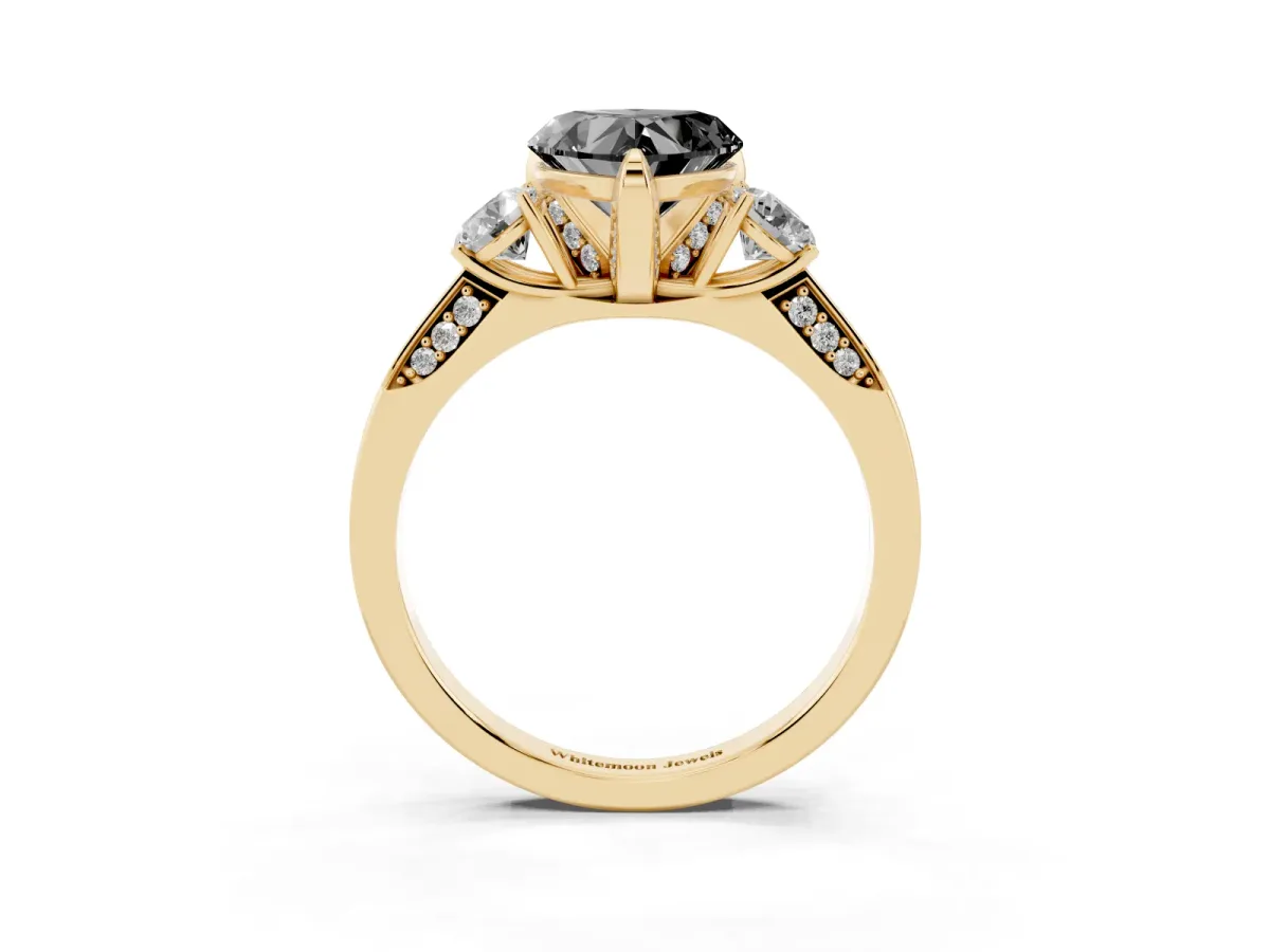 Fancy Black Heart Cut Brilliant Three-Stone Diamond Ring with Pavé Band and Four-Prong Setting Yellow gold