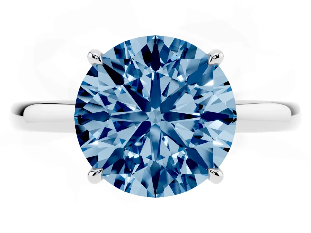 Fancy Blue Round Cut Solitaire Engagement Ring with Cathedral Band and Four-Prong Setting Silver
