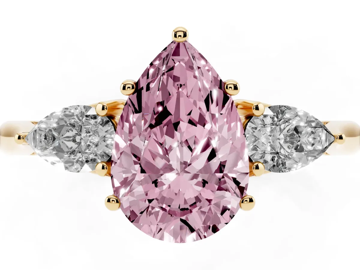 Fancy Pink Three-Stone Pear Cut Brilliant Diamond Solitaire Ring with Tapered Band and Four-Prong Setting Yellow gold