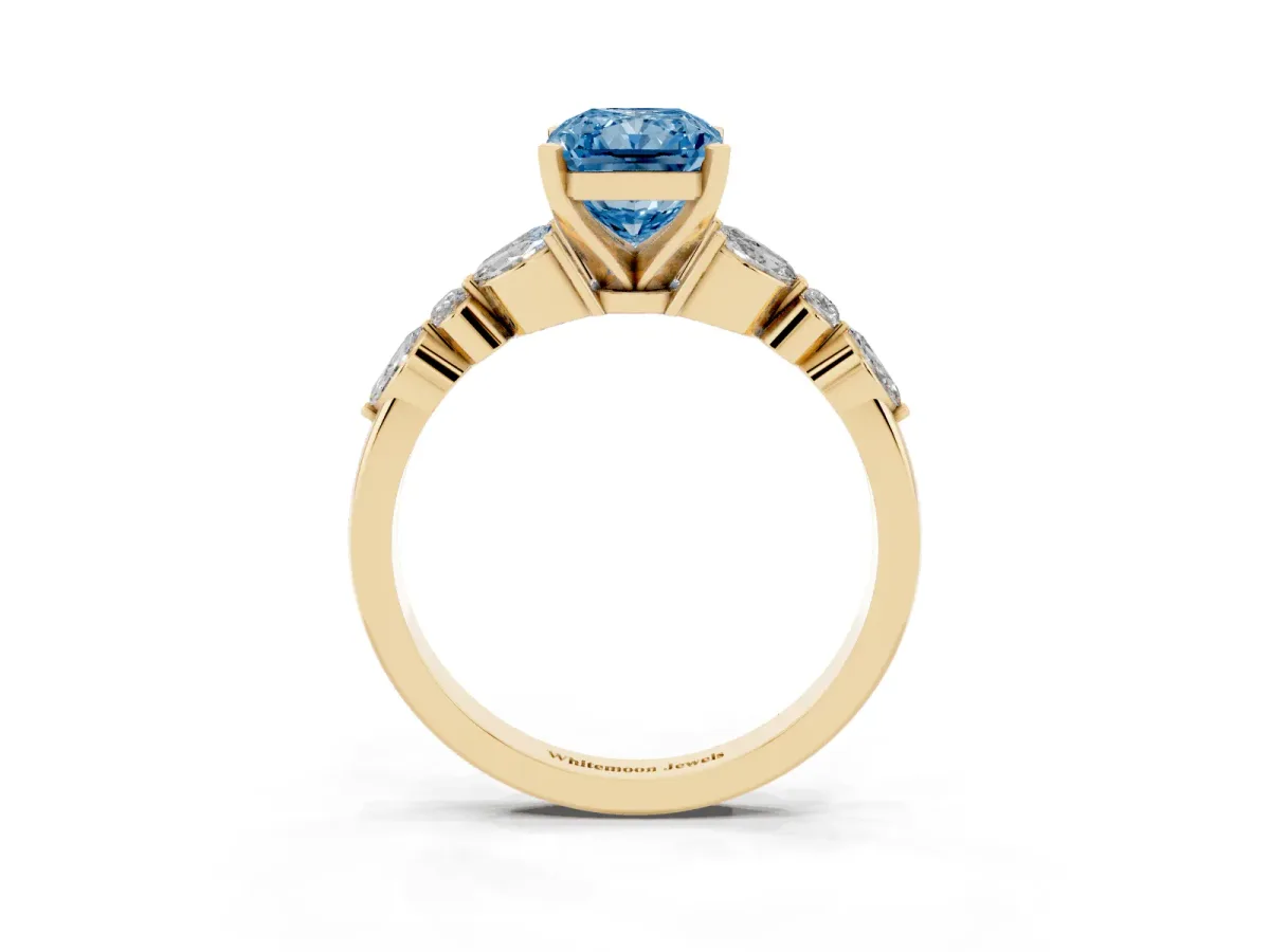 Fancy Blue Radiant Cut Diamond Solitaire Ring with Side Stones and Four-Prong Setting Yellow gold