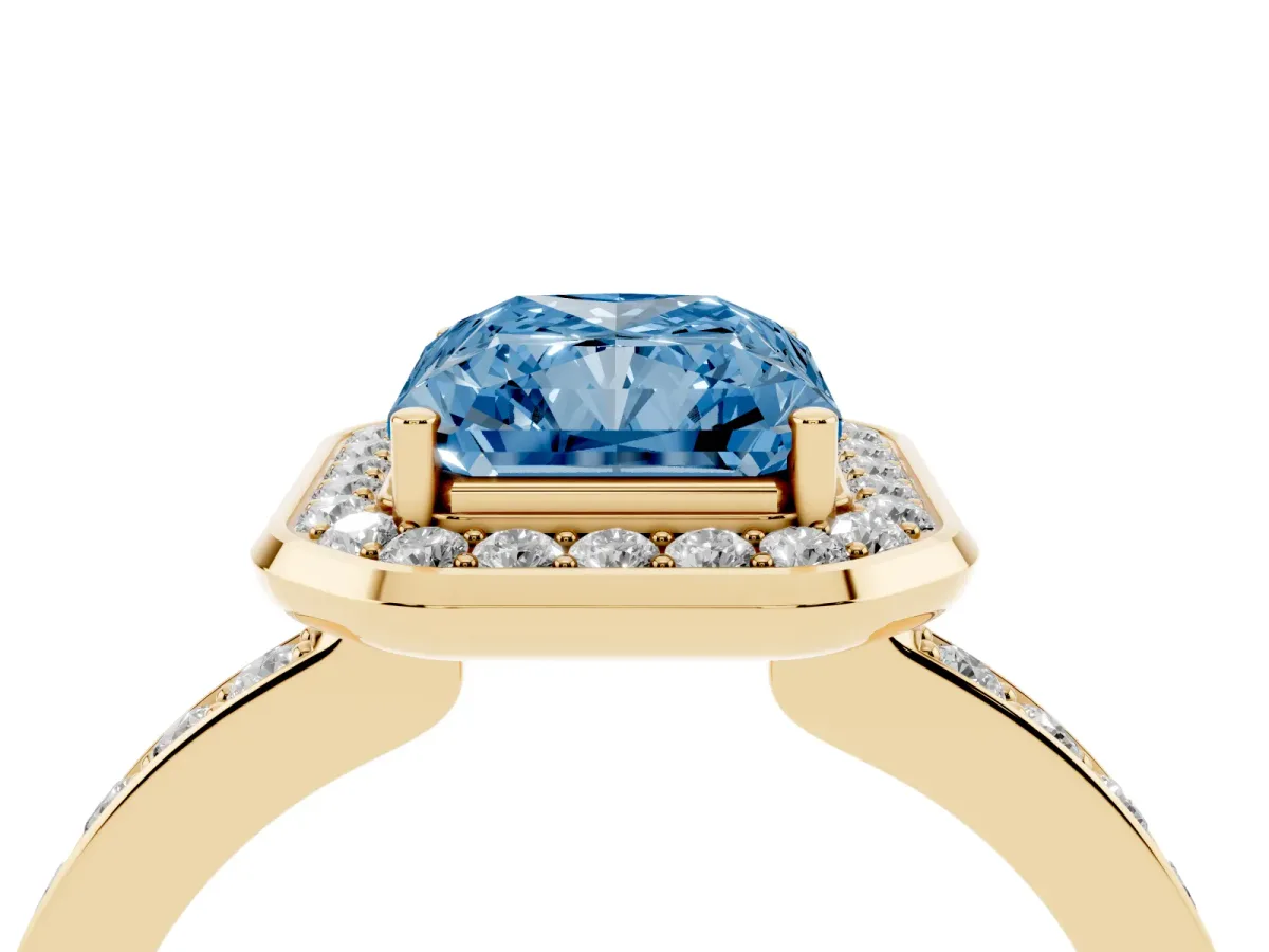 Fancy Blue Radiant Cut Diamond Halo Ring with Bezel Frame and Pavé Band Yellow gold