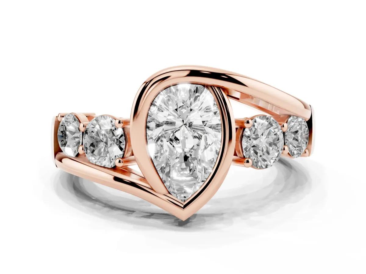 Bezel Set Pear Cut Diamond Bypass Ring with Round Accents Rose gold