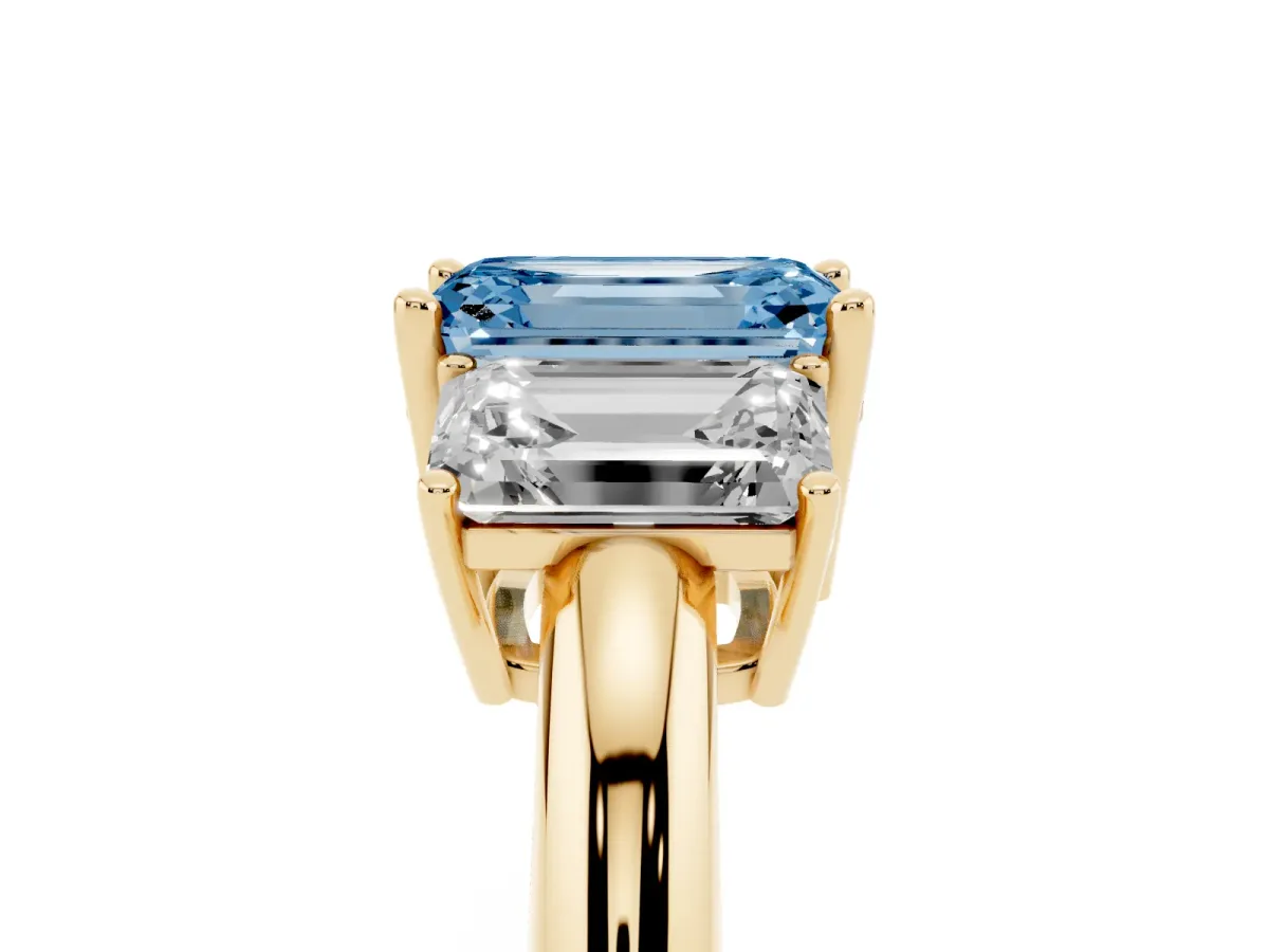 Fancy Blue Three-Stone Emerald Cut Cut Diamond Engagement Ring with Prong Setting on a White Gold Band Yellow gold