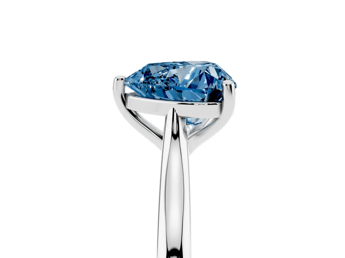 Fancy Blue Heart Cut Cut Solitaire Ring with Cathedral Band and Four-Prong Setting Silver