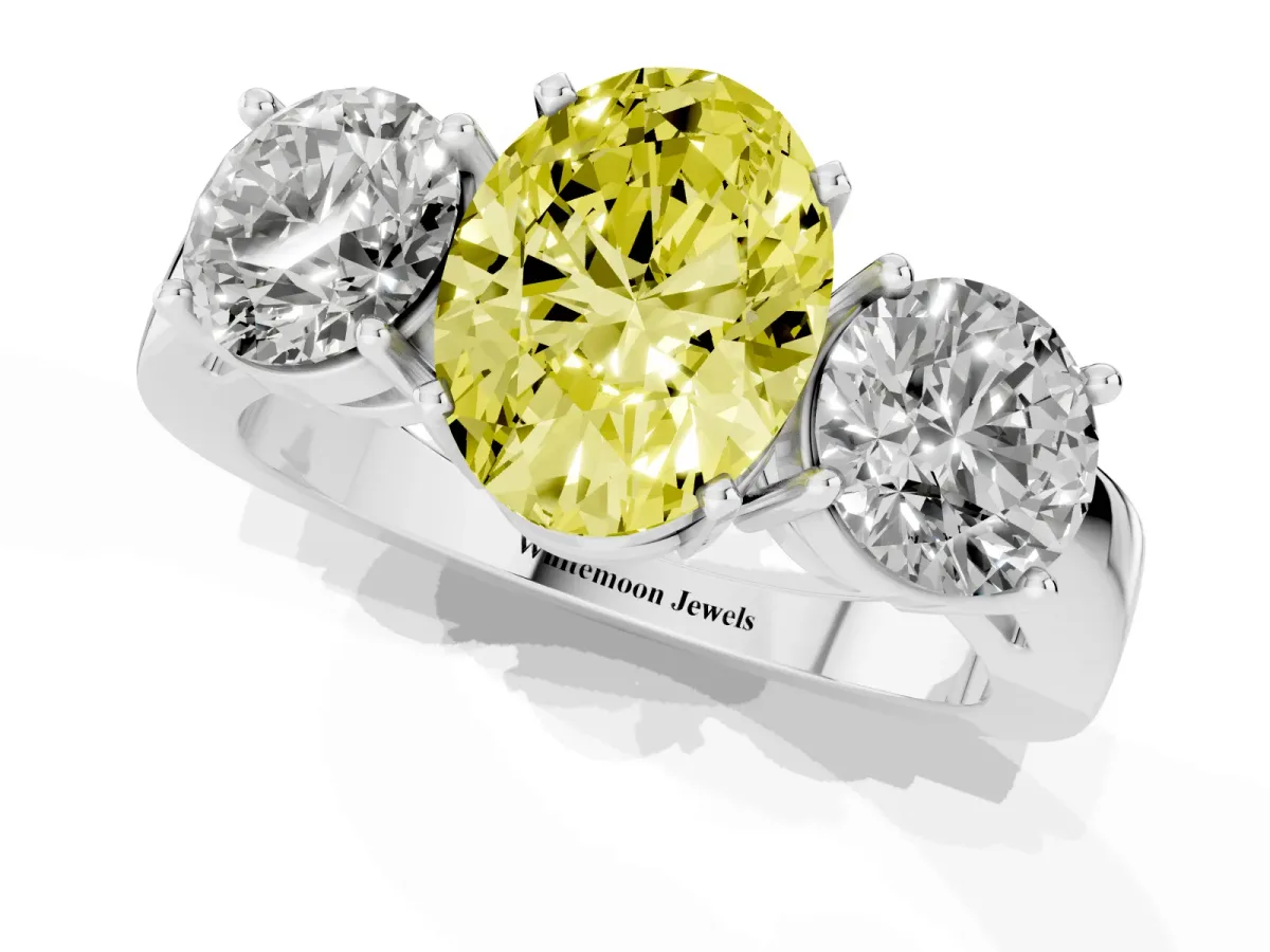 Fancy Yellow Three-Stone Oval Cut Diamond Ring with Round Side Stones, Classic Band, and Four-Prong Setting Silver