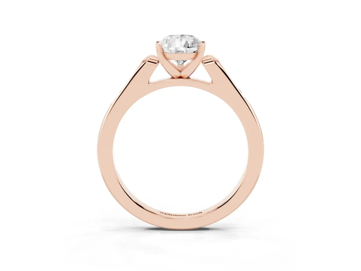 Pear Cut Diamond Solitaire Ring with Channel Set Round Band and Prong Setting Rose gold