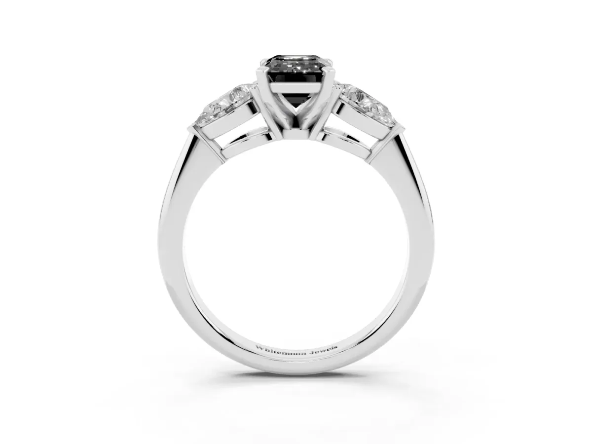 Fancy Black Three-Stone Emerald Cut Diamond Ring with Pear Side Stones and Four-Prong Setting Platinum