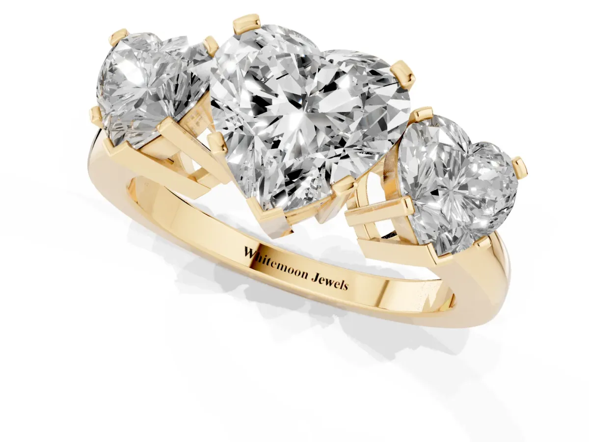 Three-Stone Heart Cut Cut Diamond Ring with Channel Set Band and Four-Prong Setting Yellow gold