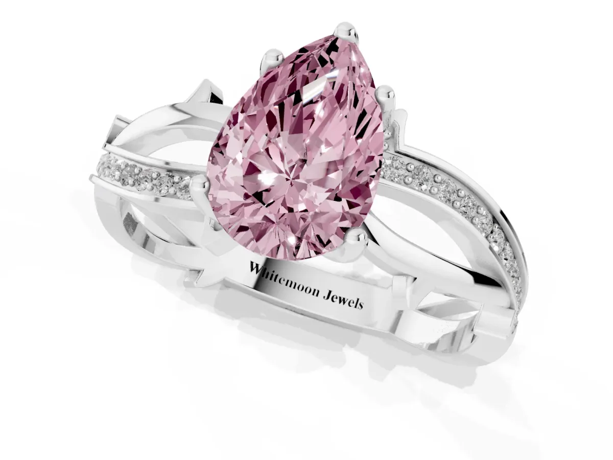 Fancy Pink Pear Cut Solitaire Twist Band with Pavé Accents and Four-Prong Setting Silver