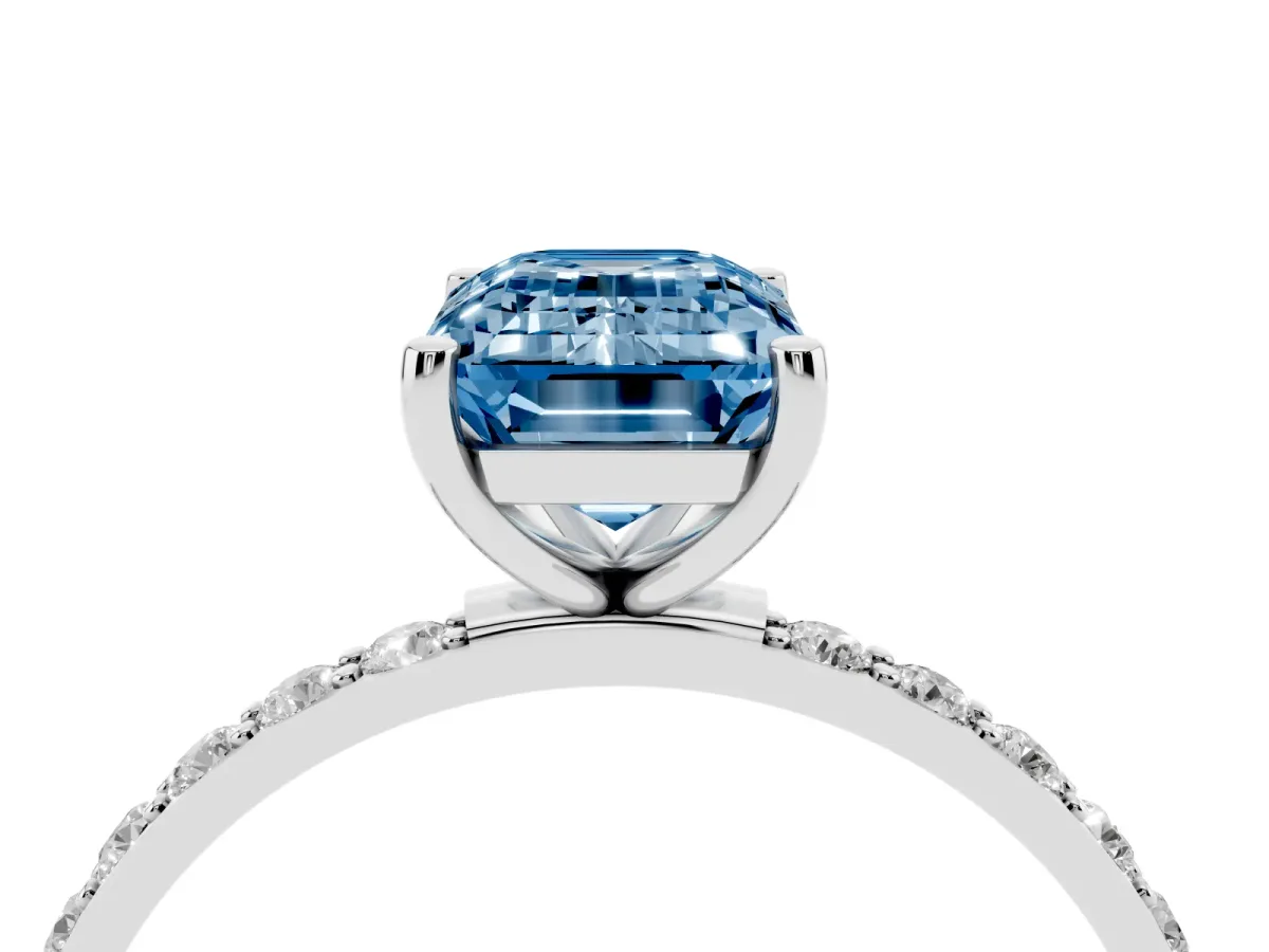 Fancy Blue Emerald Cut Diamond Solitaire Ring with Round Pavé Shoulders and Prong Setting Platinum