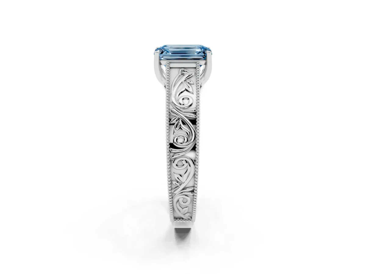 Fancy Blue Emerald Cut Diamond Solitaire Ring with Engraved Band and Four-Prong Setting Platinum