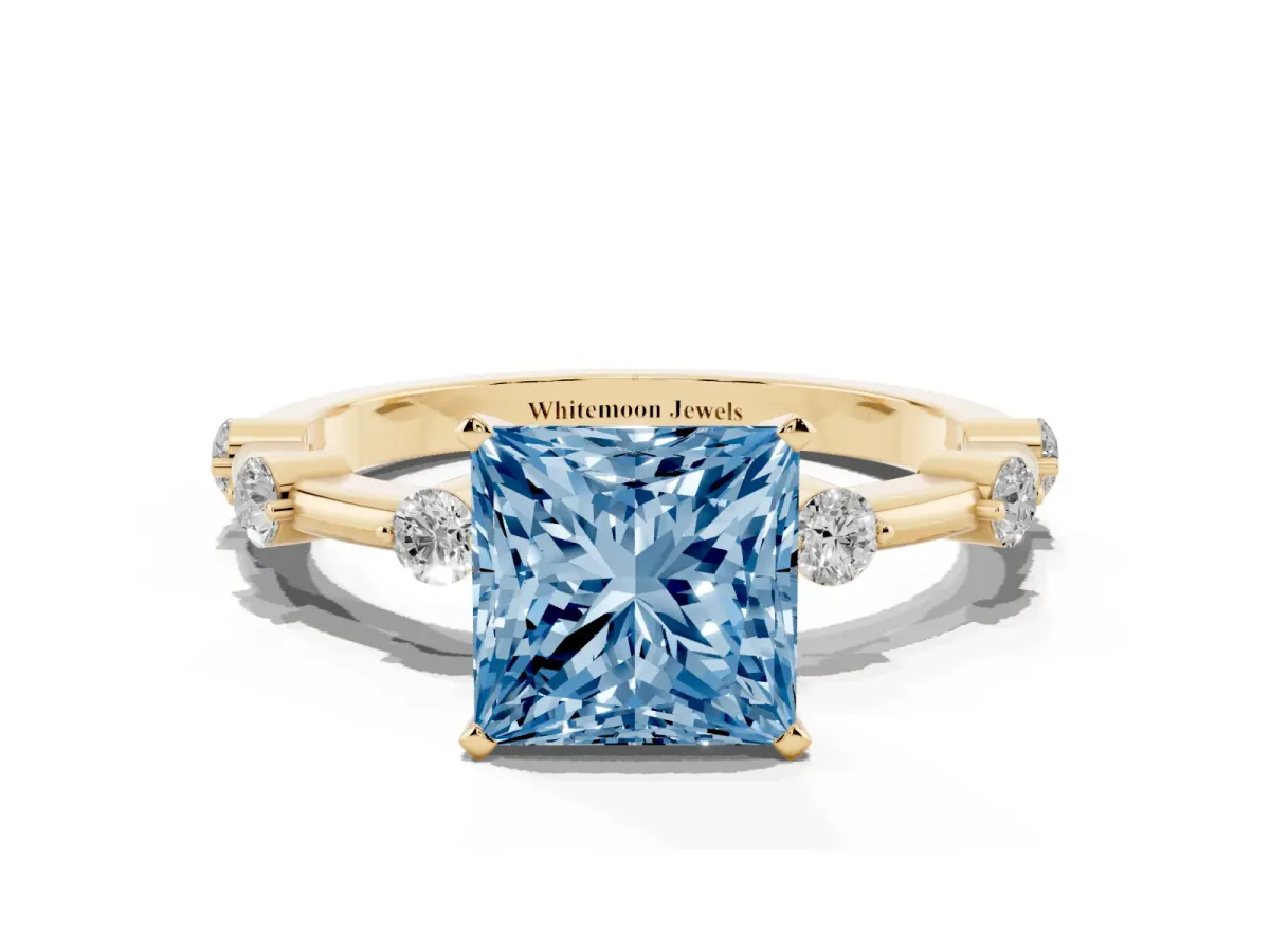 Fancy Blue Princess Cut Solitaire Diamond Ring with Bezel Set Side Stones and Prong Setting Yellow gold