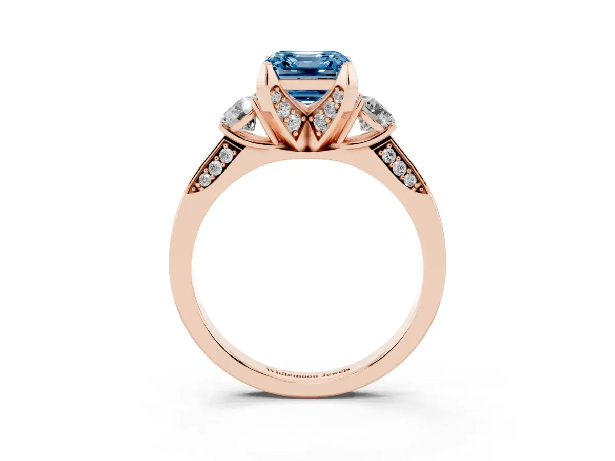 Fancy Blue Asscher Cut Brilliant Three-Stone Diamond Ring with Pavé Band and Four-Prong Setting Rose gold